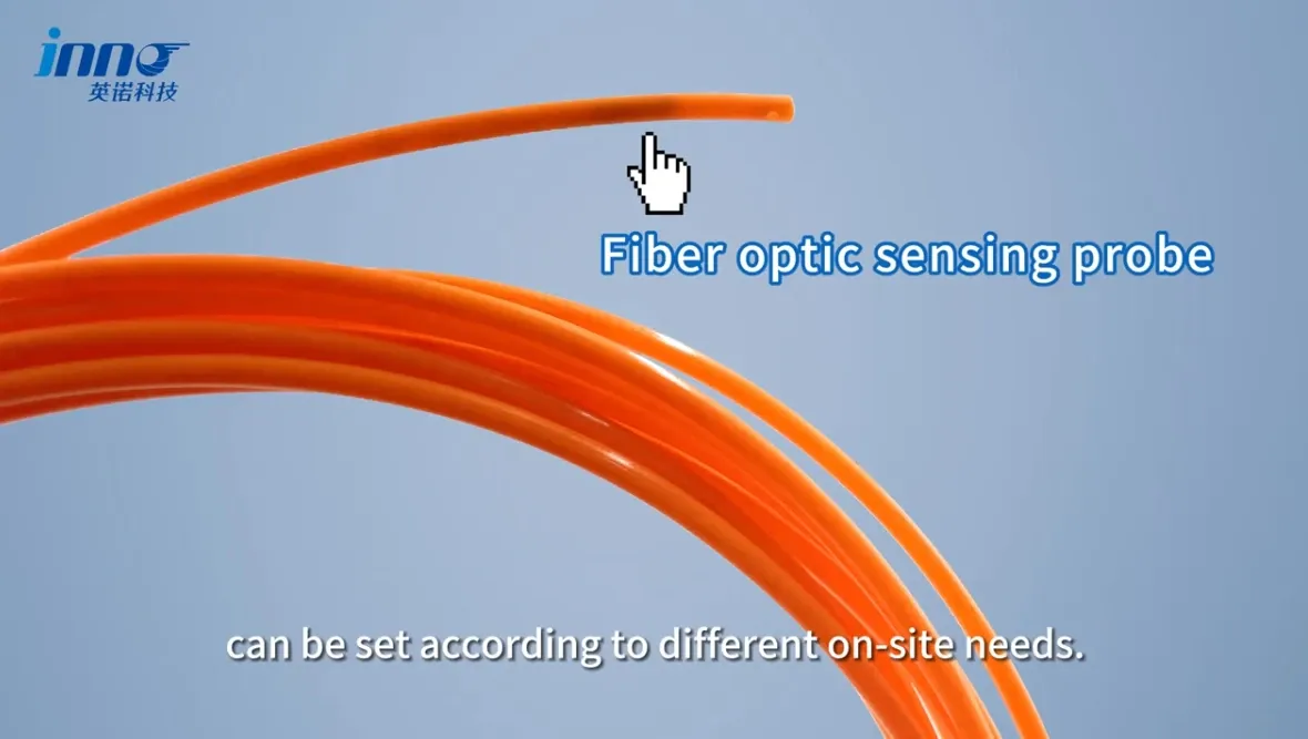 INNO orange fiber optic temperature sensing probe with its sensing tip and coiled optical fiber