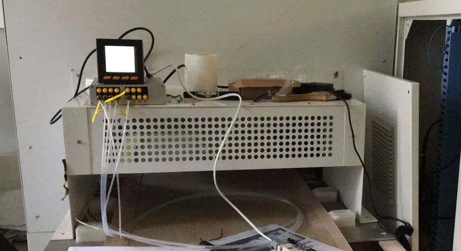 Fiber optic temperature measurement instrument and probe leads installed in RF test equipment