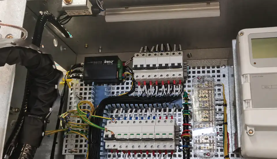 Technician reviewing switchgear installation